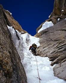 An AAI guide high in the Ham and Eggs couloir on the Moose's Tooth.
