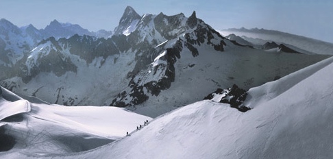 Climbers descending the Aiguille du Midi, with the North Face of the Grandes Jorasses in the background.