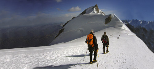 Two climbers approaching Mt. Maudit after successfully climbing Mont Blanc.