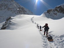 Advancing camp on Denali with full sleds.